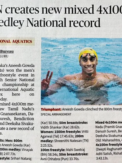 A news clipping celebrating Aneesh Gowda's triumphant 800m freestyle title.
