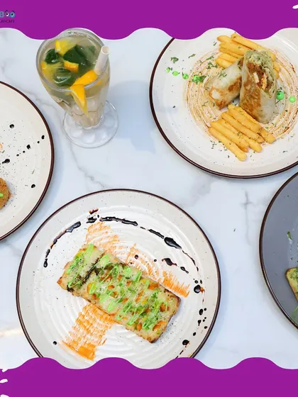 A feast for the eyes and the palate. A spread of our cafe's offerings, including appetizers and fresh juice.