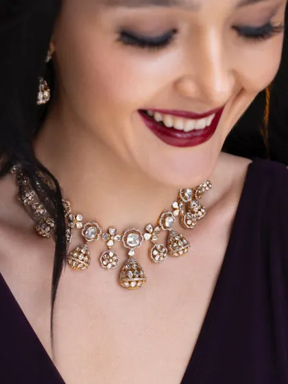A candid, joyful moment from a classic jewelry shoot. This style captures the feeling of wearing beautiful pieces, focusing on the emotional connection to luxury accessories.