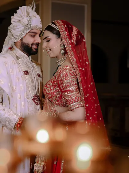 An intimate portrait of the couple, with soft bokeh lighting creating a romantic mood.