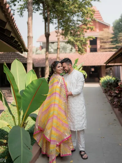 A romantic portrait of the couple at the Avadh Utopia Vapi resort before their Haldi ceremony.