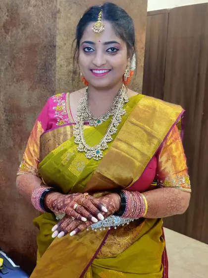 This is my favorite person, my best friend, looking absolutely stunning. I draped this gorgeous olive green and pink saree for one of her wedding events, ensuring she felt as amazing as she looked.