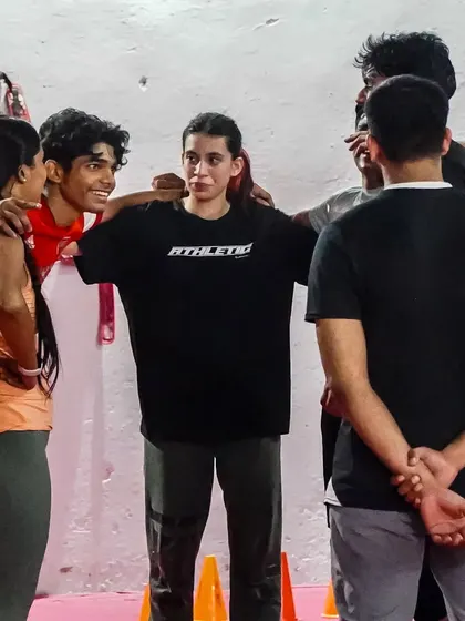 A group huddle after a tough training session. This is our family, our tribe. We support and motivate each other every day.