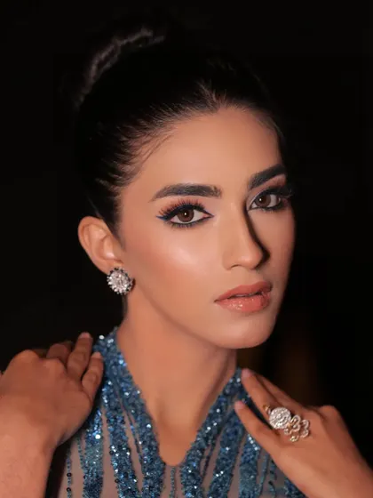 A beautiful portrait highlighting the intricate beadwork and the model's stunning features.