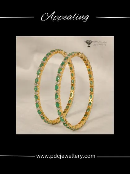 Appealing emerald and diamond bangles in 18kt hallmark gold. The vibrant green of the emeralds provides a beautiful contrast to the sparkling diamonds.