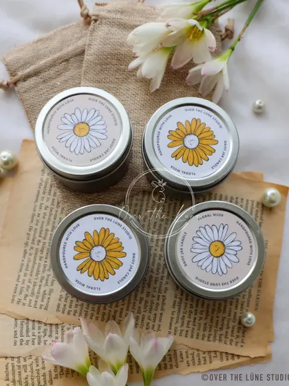 The packaging for my new Daisy Mini Candles. The simple, floral-themed label matches the cottagecore aesthetic of the candle inside.