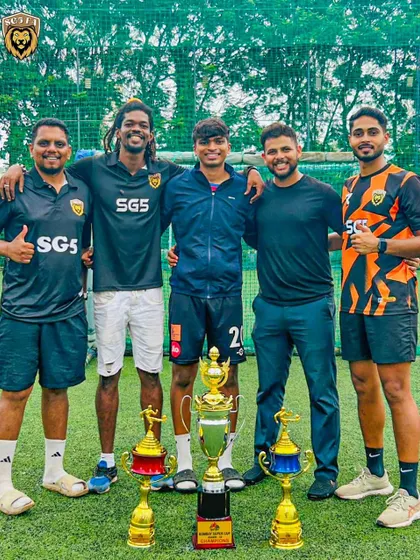 Our coaching staff with the spoils of victory. A proud moment showcasing the numerous trophies won at the Bombay Super Championship.