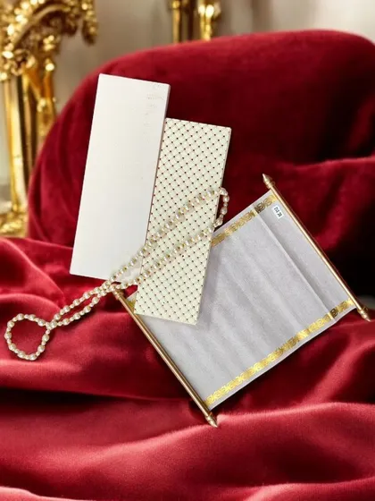 A premium scroll invitation, perfect for a royal-themed event. This invitation comes in a beautiful box and is crafted with high-quality materials for a luxurious feel.