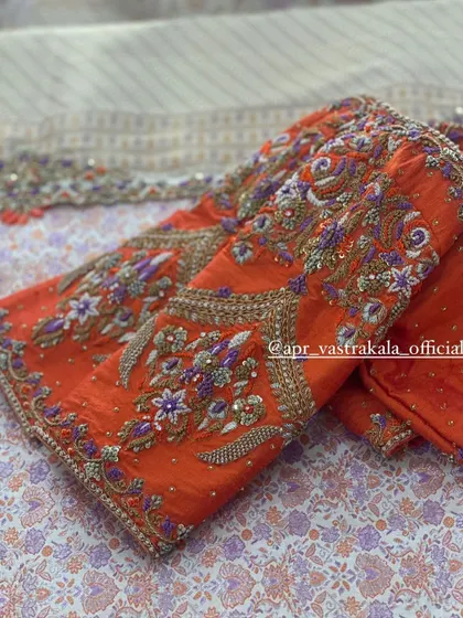 Another view of the orange bird motif blouse.