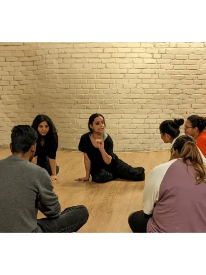 Flow with your body's wisdom. Our founder, Sahiba, leads a discussion circle, a common practice in our classes to foster connection and reflection.