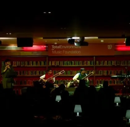 A wide shot of a collaborative performance with my brother and our band at Windmills. This shows our ability to create a large ensemble, combining sitar duets with a full fusion band.