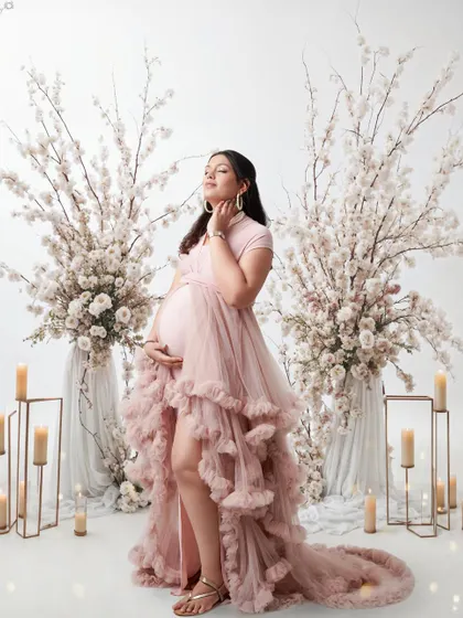 This is for the mom who wants a truly dreamy and elegant maternity session. We created a fairytale setting with flowing gowns, soft candlelight, and beautiful floral arrangements to celebrate her journey to motherhood.