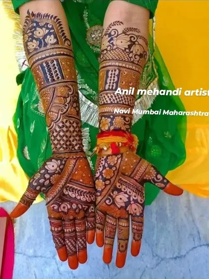 A colorful and vibrant shot of a traditional bridal mehendi. The design includes floral bands and geometric patterns, perfect for a festive occasion.