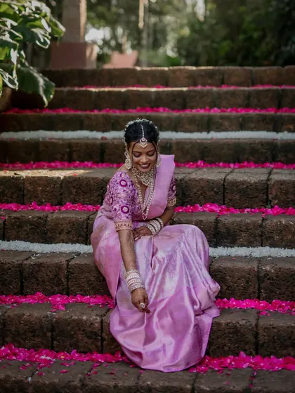 A beautiful bride framed by a traditional doorway. We use architectural elements and natural light to create artistic and striking portraits that highlight her grace.