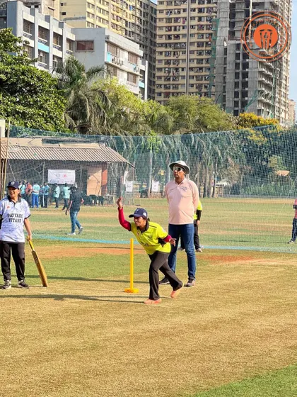A woman in mid-delivery action during a PPL match, demonstrating the enthusiasm and skill on display in our women's cricket games.