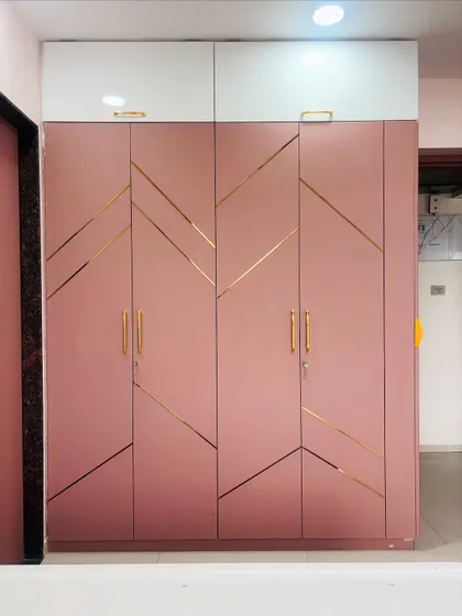 The full wardrobe unit, including the white loft cabinets on top that provide extra storage and a pleasing color contrast.