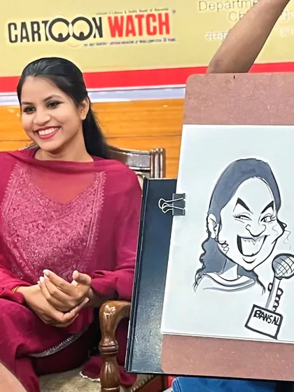 This picture says it all. The pure, uncontainable joy on a guest's face after seeing her caricature for the first time is the reason I love what I do.