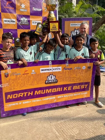 The U11 team celebrating their North Mumbai Ke Best championship title.