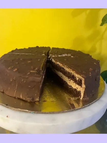 My Almond Rocher cake is a celebration of texture and flavor. It features crunchy almond layers that envelop a rich, velvety chocolate center. It’s one of my signature cakes and a true indulgence.