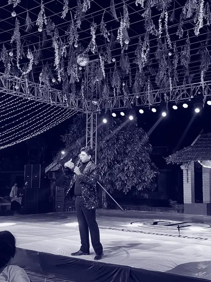 A quiet moment on stage before the festivities begin. The lights, the setup, the anticipation. This is my space, where I prepare to create an evening of memories for you.