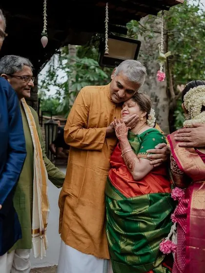 A wedding so close to our hearts. This touching photograph captures the emotional embrace between family members, a testament to the deep connections we aim to preserve.