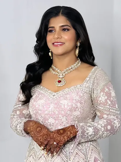 A client looking stunning in our statement Victorian necklace with a large ruby-red pendant. It's the perfect centerpiece for a reception or engagement outfit.