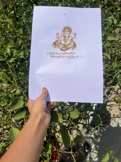 This image shows the Ganesha artwork held up, giving you an idea of the scale and detail. Practicing on paper is an important step in my teaching method to build your skills.