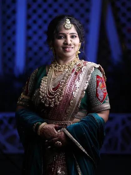 A portrait of a client looking absolutely beautiful and confident in her traditional Maharashtrian bridal attire.