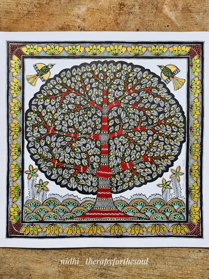 The Madhubani 'Tree of Life' on paper, shown before framing. The contrast between the detailed, colorful tree and the clean white border makes the artwork pop.