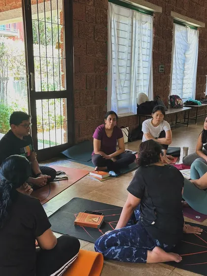 Our workshops are not just about practice, but also about community and discussion. Here, students gather after a pranayama session to share insights and deepen their understanding together.