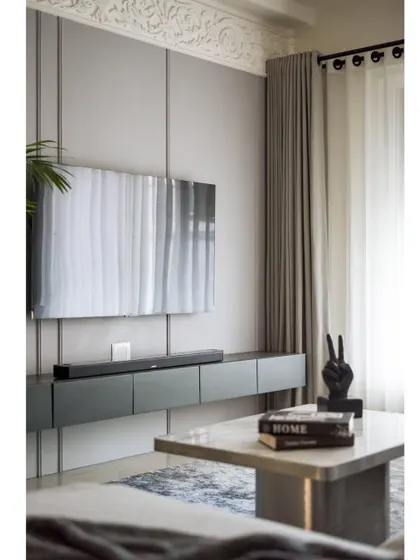 A full view of the TV wall and center table. The entire ensemble is a perfect balance of modern design and classic elegance.