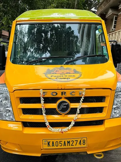 A front view of our Doggie School Bus, freshly blessed and ready for its first journey. We take every detail seriously.