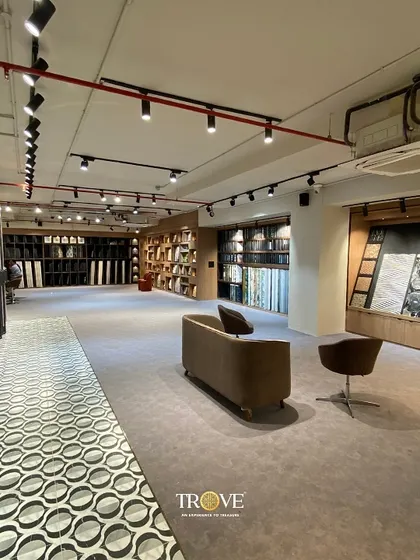 I love how this patterned tile walkway guides you through the showroom. It demonstrates how you can use floor tiles to create movement and define spaces within an open-plan layout, leading the eye towards different design possibilities.