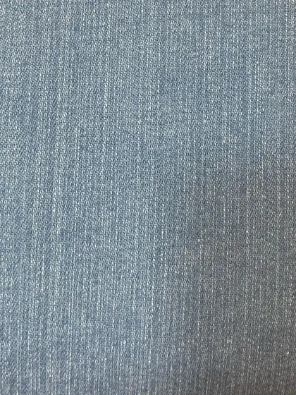 The subtle vertical grain of a light blue denim. This classic fabric is versatile and can be used for a wide range of jean styles and fits.