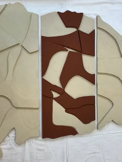The full three-panel artwork with the terracotta section, laid out and ready for its new home.