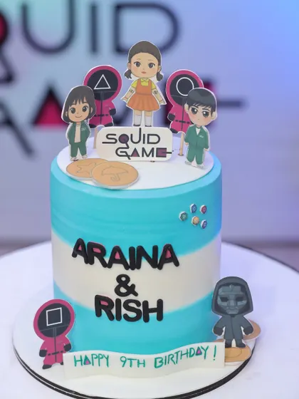 The custom-designed cake for the 'Squid Fiesta' party. I work with vendors to ensure every detail, including the cake with its themed toppers, perfectly matches the party's concept.