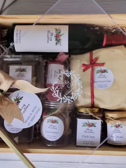 A stunning wooden crate Christmas hamper fully decked out with our custom-designed stickers for a festive and branded touch.