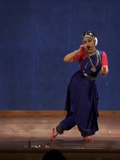 Here, I am depicting a character from a classical story, using my body and expression to communicate her feelings. This form of storytelling, or 'Abhinaya', is central to Bharatanatyam and a key focus in my advanced classes.