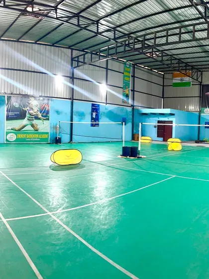 A wide view of our professional indoor badminton courts. We provide a well-lit, spacious, and fully equipped environment for players to train and excel.