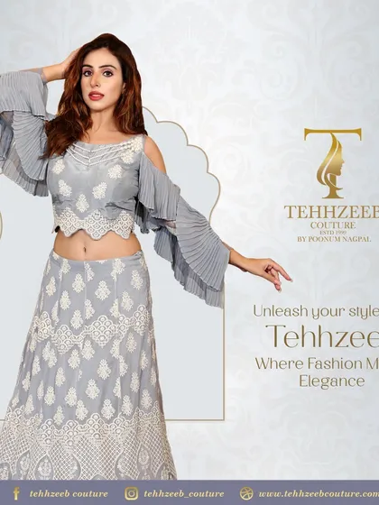 This grey co-ord set features a crop top with cold-shoulder pleated sleeves and a matching embroidered skirt. It's a unique and elegant choice for a modern fashionista.