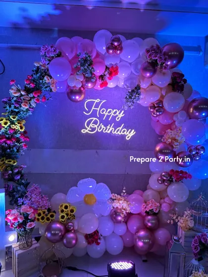 These images showcase the details of the floral 14th birthday, including the light-up numbers and the mix of balloons and flowers that create a fun yet sophisticated look for a teenager.