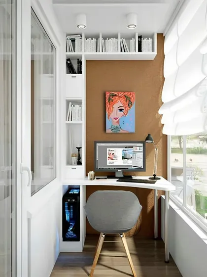 A compact and highly organized balcony workspace. This design features a custom-built unit with a desk, vertical shelving, and cabinets, making the most of a narrow space while keeping everything tidy.