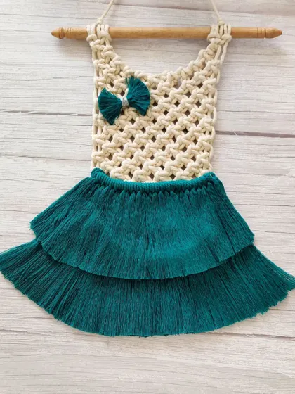 The full view of the adorable macrame dress wall decor.