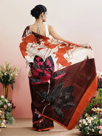 A repeat of the brown abstract floral saree, a bold and modern choice.