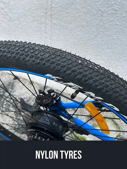 The nylon tyres on this Heileo M200 offer good grip and durability. We check tyre pressure and condition as part of our standard e-bike safety check.