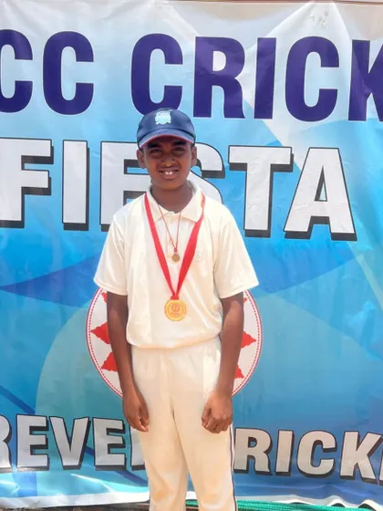 Keerthan posing with his medal.