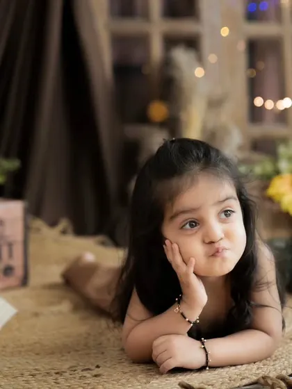 A thoughtful, pensive moment from a pre-mundan shoot. We capture the full range of your child's expressions, from big smiles to quiet contemplation.