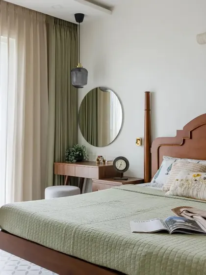 The warmth of wooden furniture and the charm of wicker elements bring a touch of nature indoors in this chic bedroom.