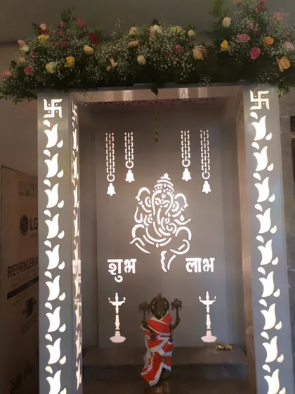Simple and modern pooja room decor. I added a fresh flower arrangement on top of this beautiful white Ganesha mandir to enhance its sanctity.