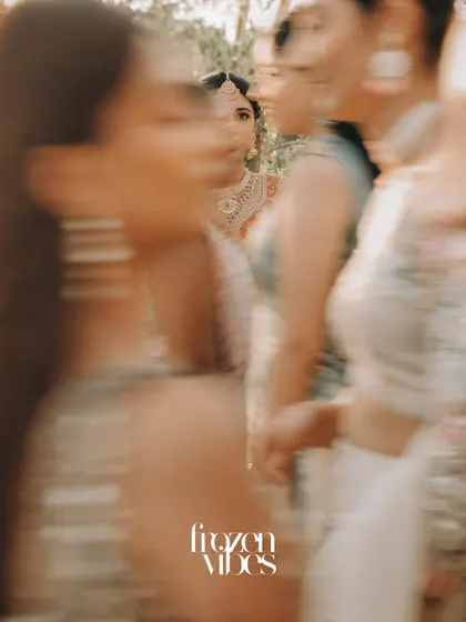 An artistic, motion-blur shot of the bride among her bridesmaids. This technique conveys the energy and excitement of the moments before the ceremony.